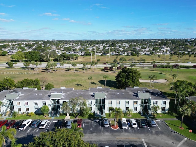 bird's eye view featuring golf course view and a residential view