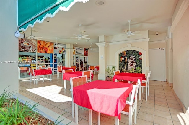 tiled dining room with ceiling fan