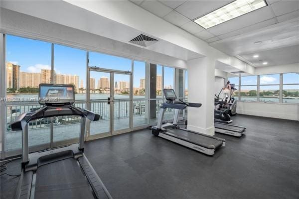 exercise room with a paneled ceiling