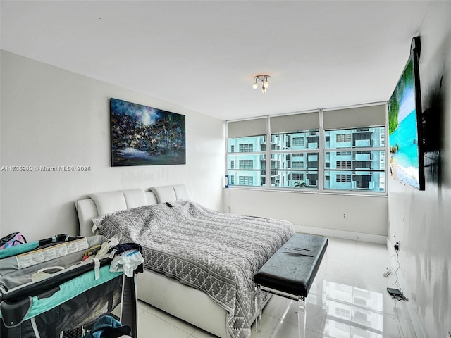 bedroom with light tile patterned floors