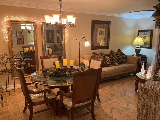 dining room featuring ceiling fan with notable chandelier and ornamental molding