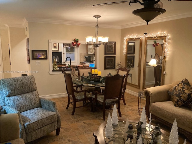 dining area featuring an inviting chandelier and crown molding