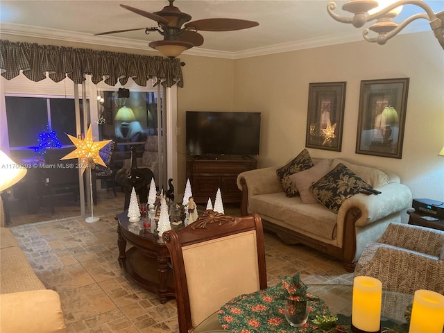 living room with ceiling fan with notable chandelier and ornamental molding