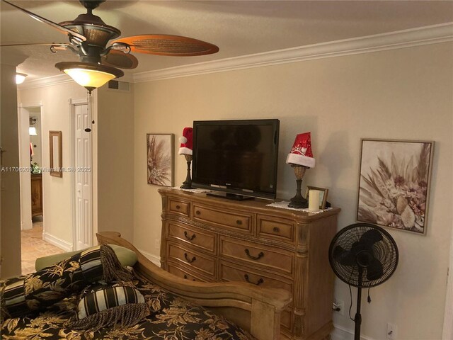 bedroom with ceiling fan and ornamental molding