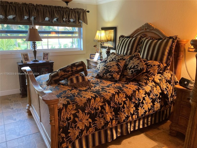 bedroom featuring multiple windows and ornamental molding