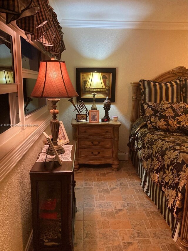 bedroom featuring crown molding