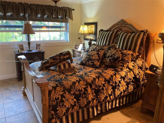 bedroom with ornamental molding