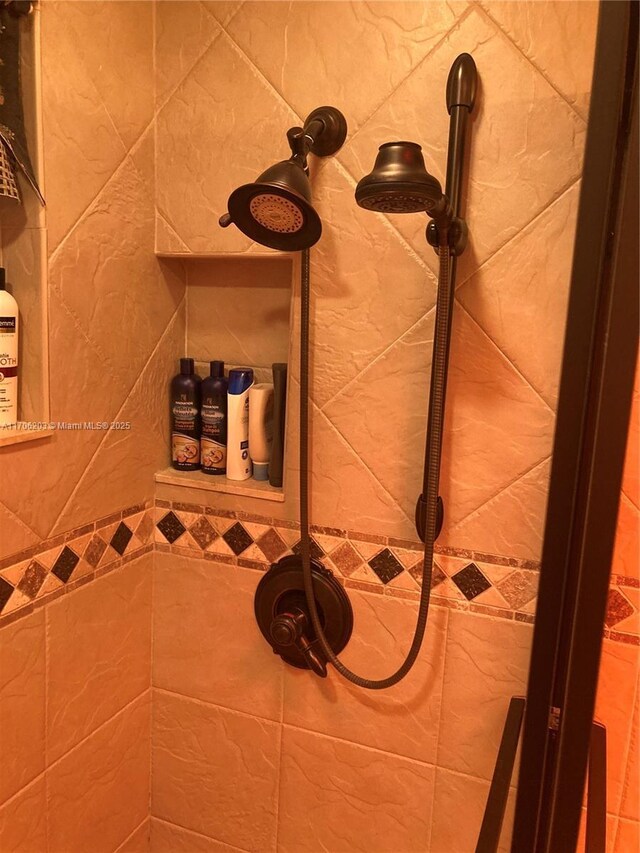 bathroom with vanity, tile walls, and toilet