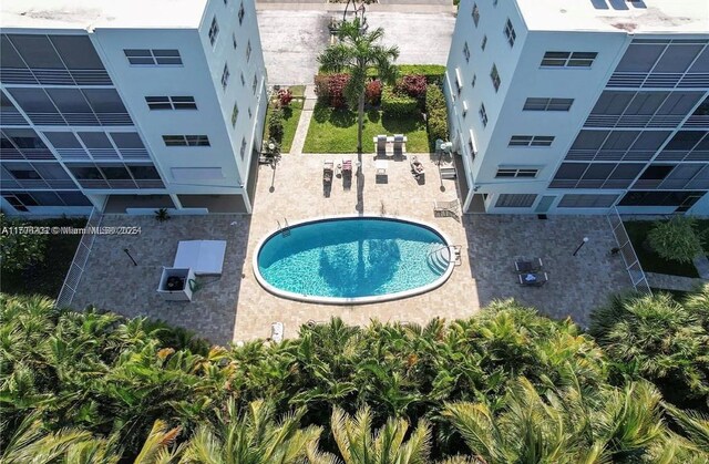 view of swimming pool with a patio