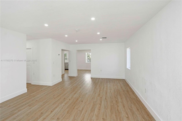 unfurnished room with light hardwood / wood-style floors