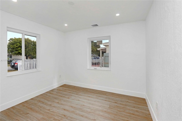 unfurnished room featuring light hardwood / wood-style flooring