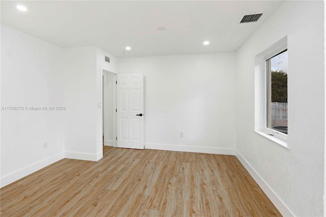 unfurnished room featuring light hardwood / wood-style floors