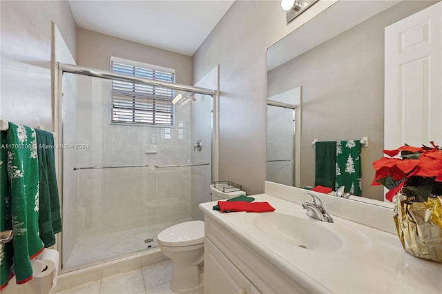 bathroom featuring tile patterned flooring, vanity, toilet, and an enclosed shower