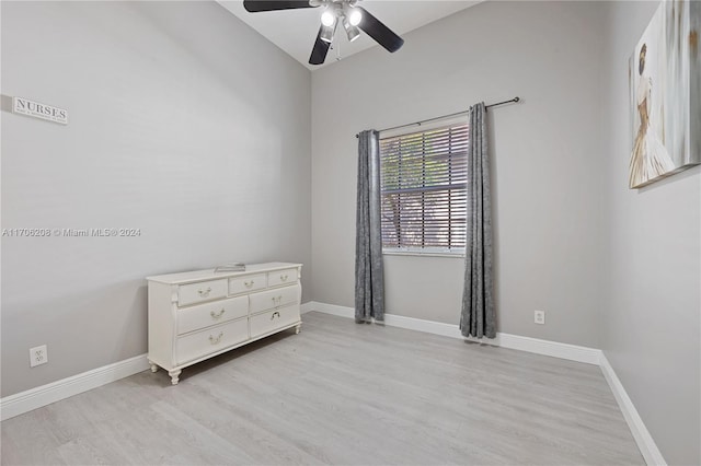 empty room with light hardwood / wood-style flooring and ceiling fan