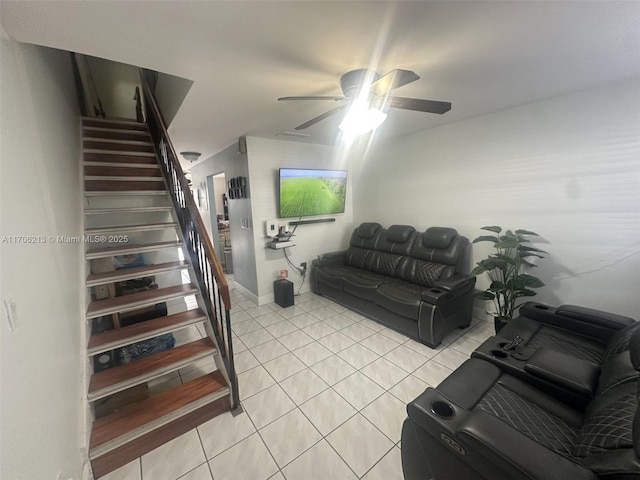 living room with light tile patterned floors and ceiling fan