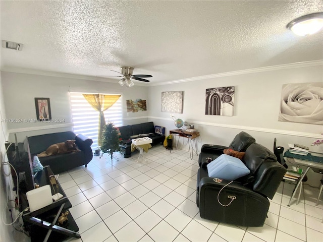 living room featuring a textured ceiling, ceiling fan, light tile patterned floors, and ornamental molding