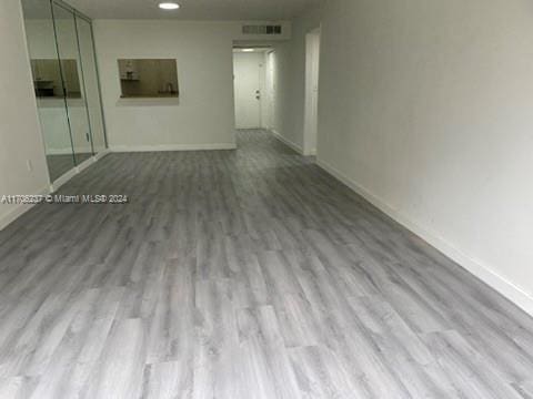 unfurnished room with light hardwood / wood-style flooring