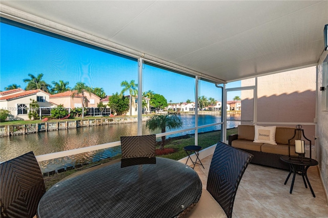 sunroom with a water view