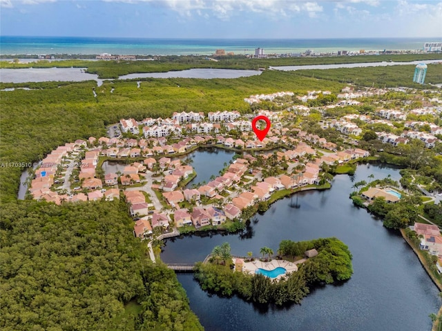 birds eye view of property featuring a water view