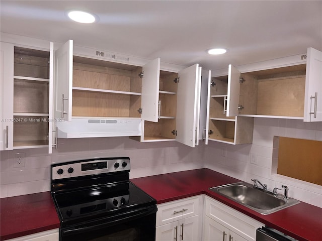 kitchen with backsplash, white cabinets, stainless steel dishwasher, sink, and black electric range