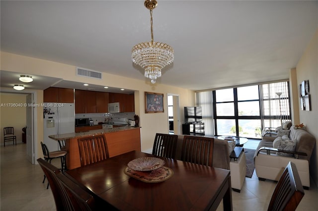 dining area featuring a notable chandelier