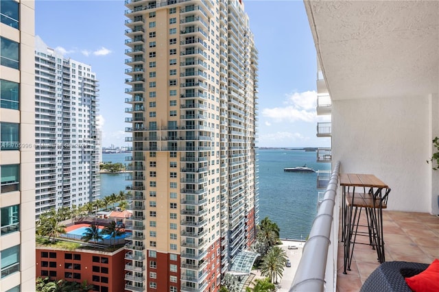 balcony featuring a water view