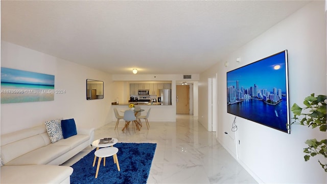 living room with a textured ceiling