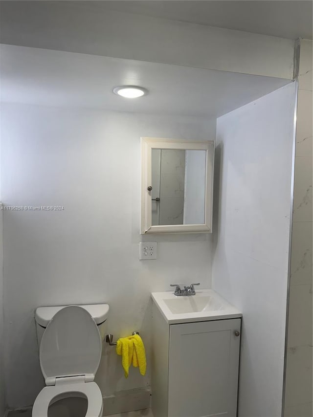 bathroom featuring vanity and toilet