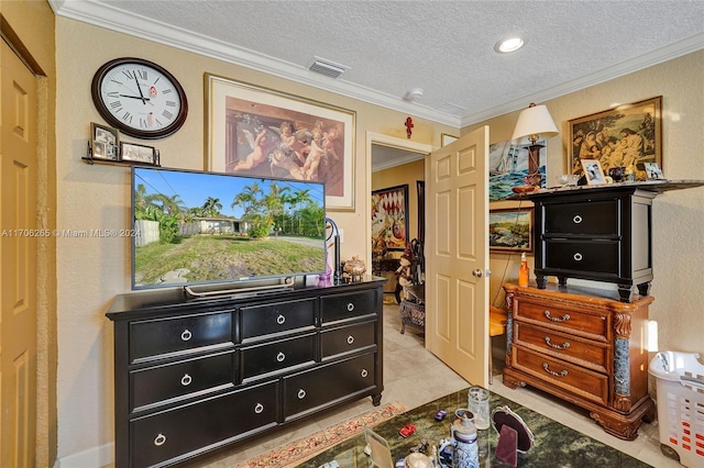 bedroom featuring a textured ceiling and crown molding