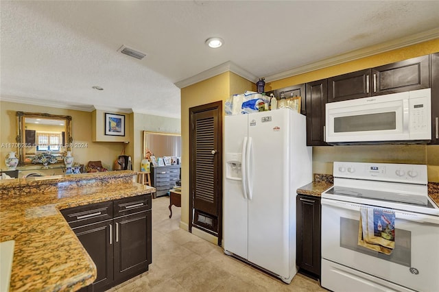 kitchen featuring a textured ceiling, dark brown cabinetry, white appliances, and crown molding