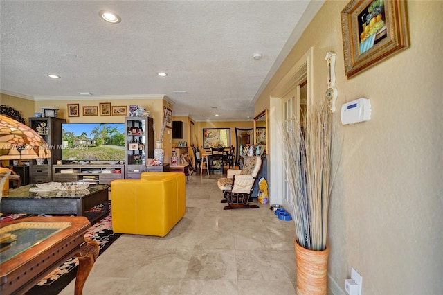 living room featuring a textured ceiling and ornamental molding