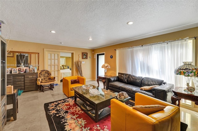 living room with light tile patterned floors, a textured ceiling, and ornamental molding