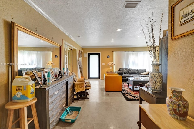 interior space with a textured ceiling and ornamental molding