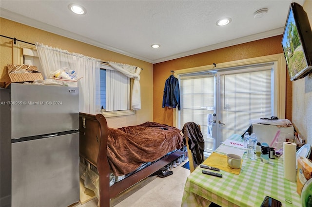 bedroom featuring carpet, stainless steel fridge, a textured ceiling, access to outside, and crown molding