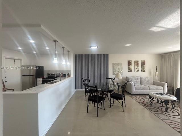 dining area with a textured ceiling