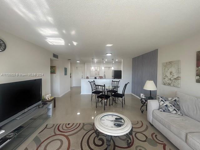 living room featuring a textured ceiling