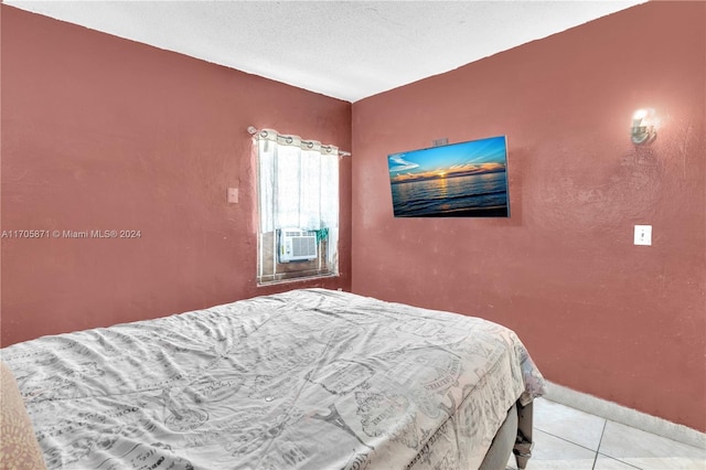 bedroom with light tile patterned floors