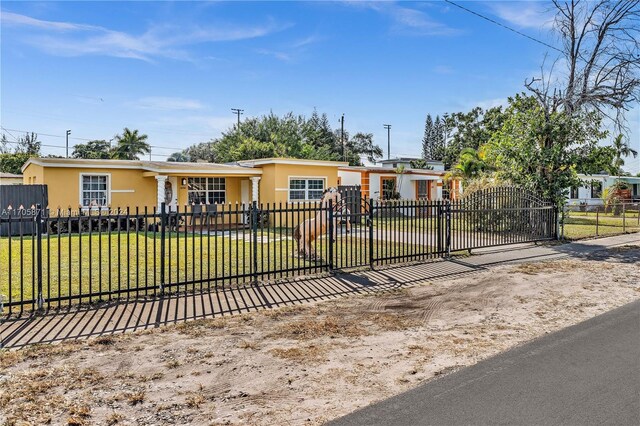single story home with a front yard