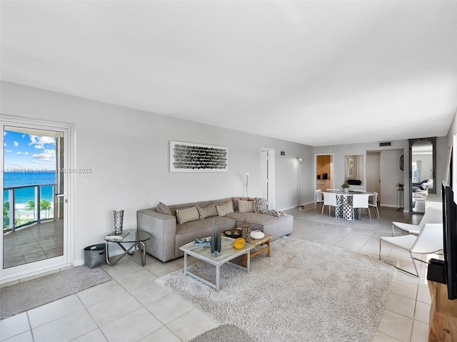 living room with light tile patterned flooring