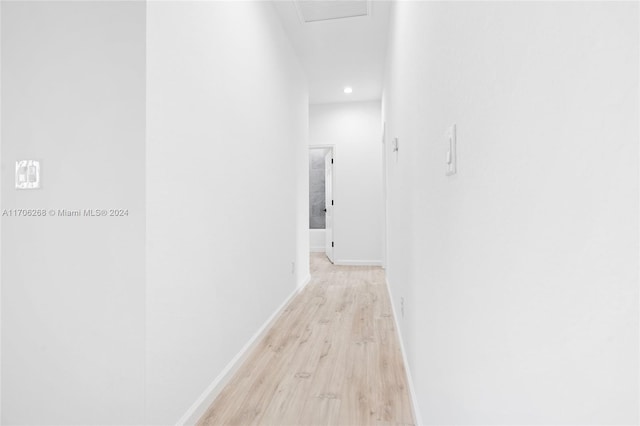 hallway with light wood-type flooring