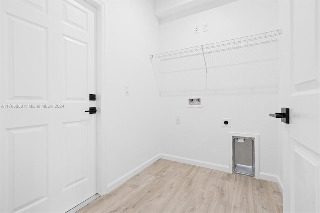 clothes washing area featuring hookup for an electric dryer, light hardwood / wood-style floors, and hookup for a washing machine