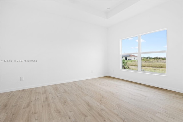 spare room with light hardwood / wood-style flooring