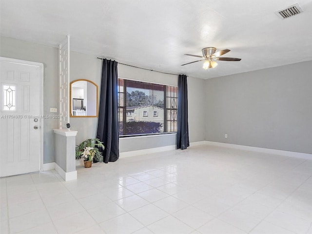 spare room with ceiling fan