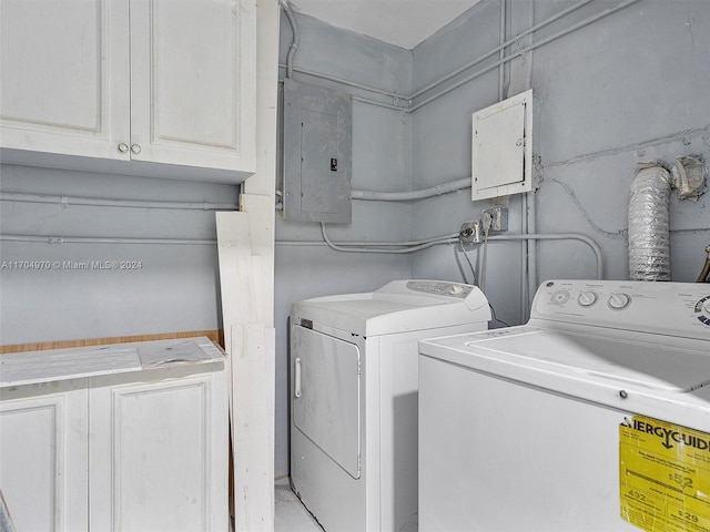 clothes washing area featuring washing machine and clothes dryer and electric panel