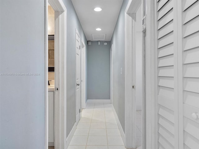 hall featuring light tile patterned flooring