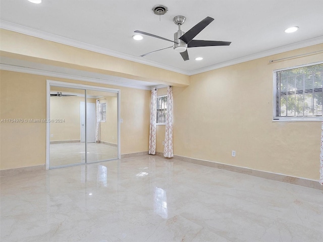 unfurnished bedroom featuring a closet, ornamental molding, and ceiling fan