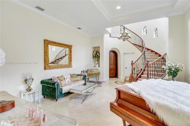 bedroom featuring a chandelier, a tray ceiling, and ornamental molding