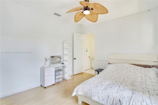 bedroom with light hardwood / wood-style flooring and ceiling fan