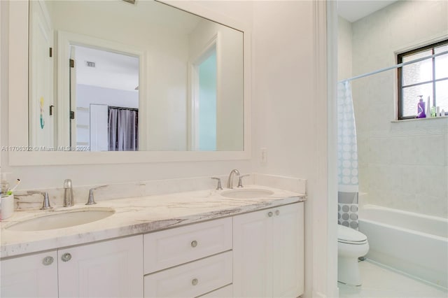 full bathroom with tile patterned floors, vanity, shower / bath combination with curtain, and toilet