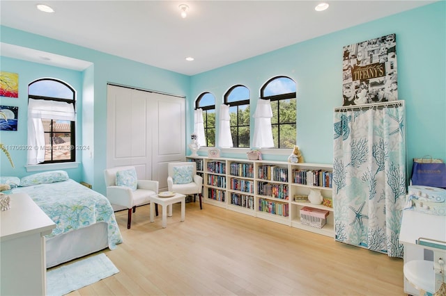 bedroom featuring a closet and light hardwood / wood-style floors